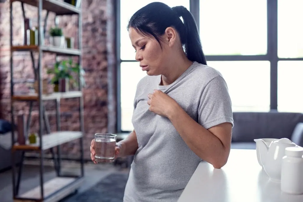 woman having hot flashes 