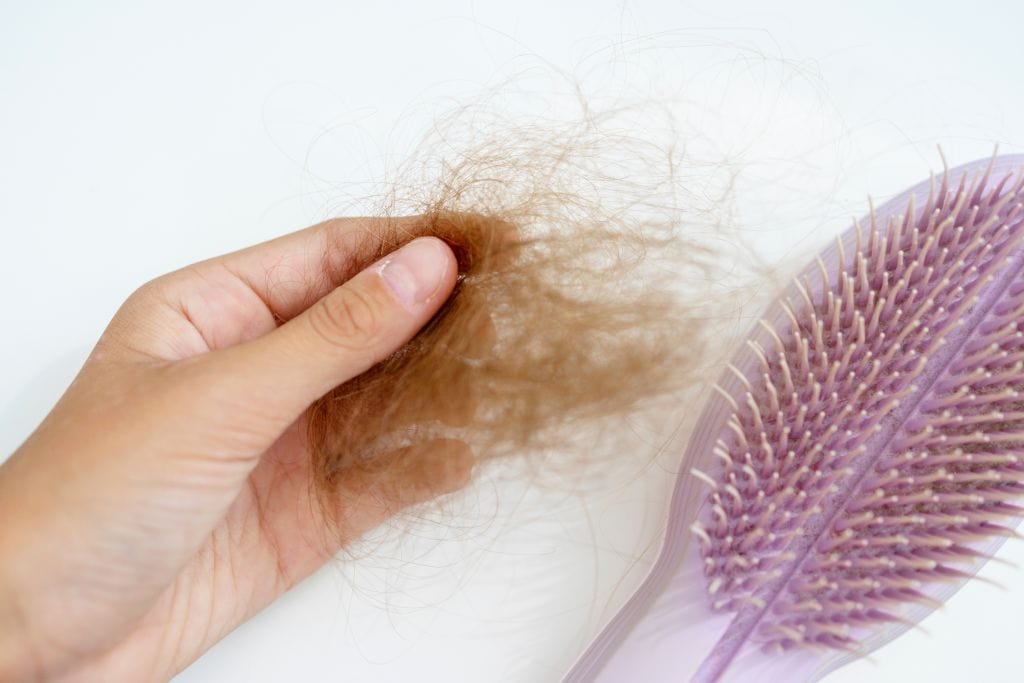 hair loss symptom - hair shedding