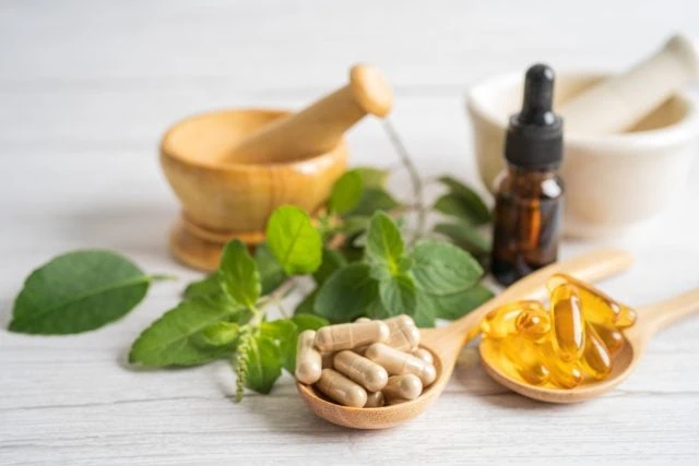 Alternative medicine herbal organic capsule drug with herbs leaf